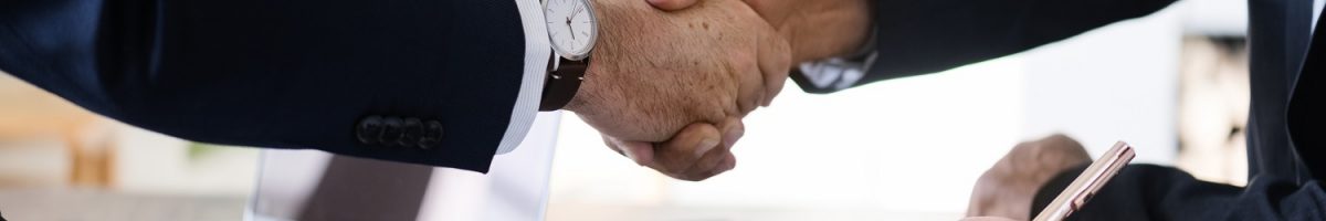 Business people shaking hands together